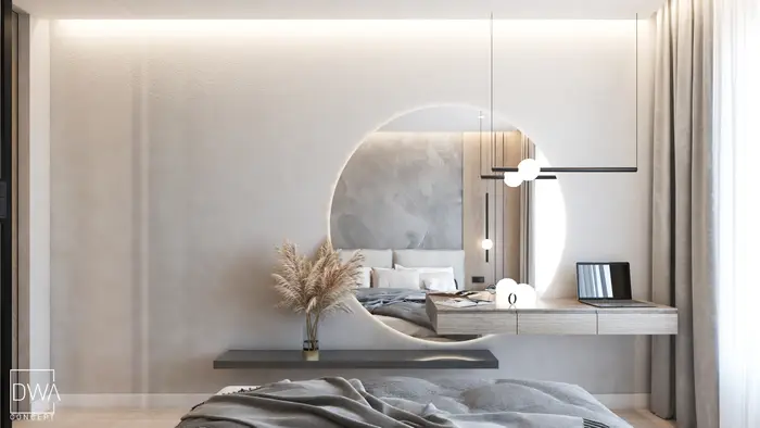 Sypialnia z okrągłym lustrem nad toaletką z biurkiem i laptopem - apartament w Krakowie