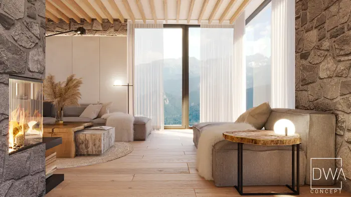 Salon z kamiennym kominkiem i sofą narożną, w oknach widok na Tatry - dom w Kościelisku