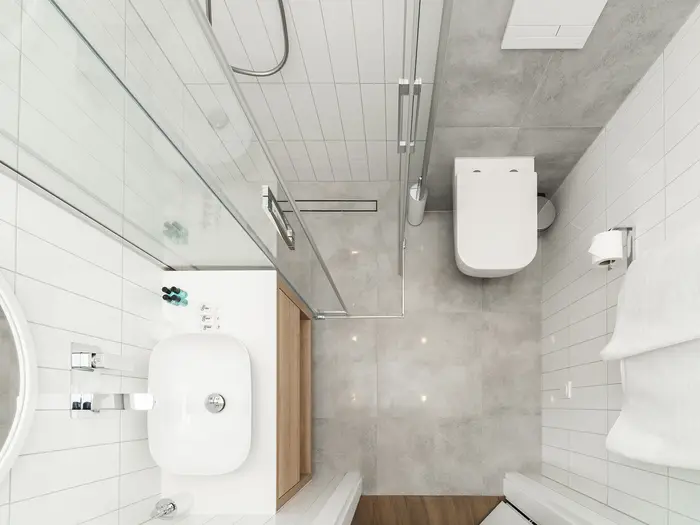 Widok z góry na łazienkę z prysznicem i toaletą wiszącą - apartament w Krakowie 22m2