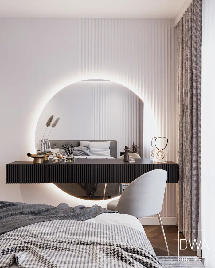 Toaletka z podświetlanym okrągłym lustrem i czarną zabudową w sypialni - apartament w Rabce-Zdroju