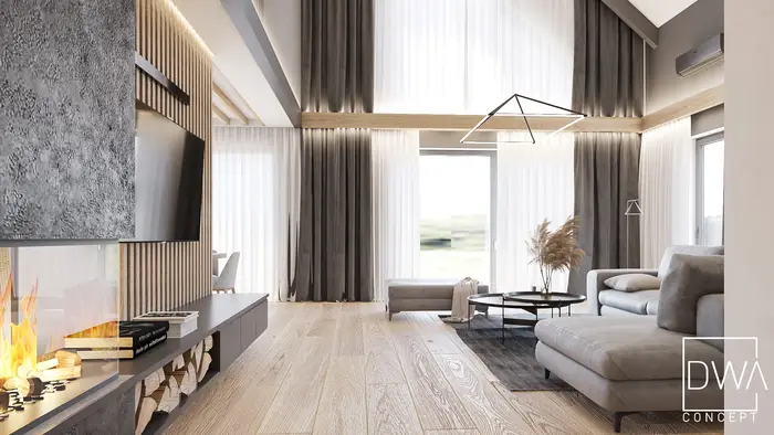 Salon z wysokimi oknami, sofą narożną i suszoną trawą pampasową - dom na Podhalu